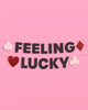 Feeling Lucky glitter banner in black, red, and pink with spade and diamond icons