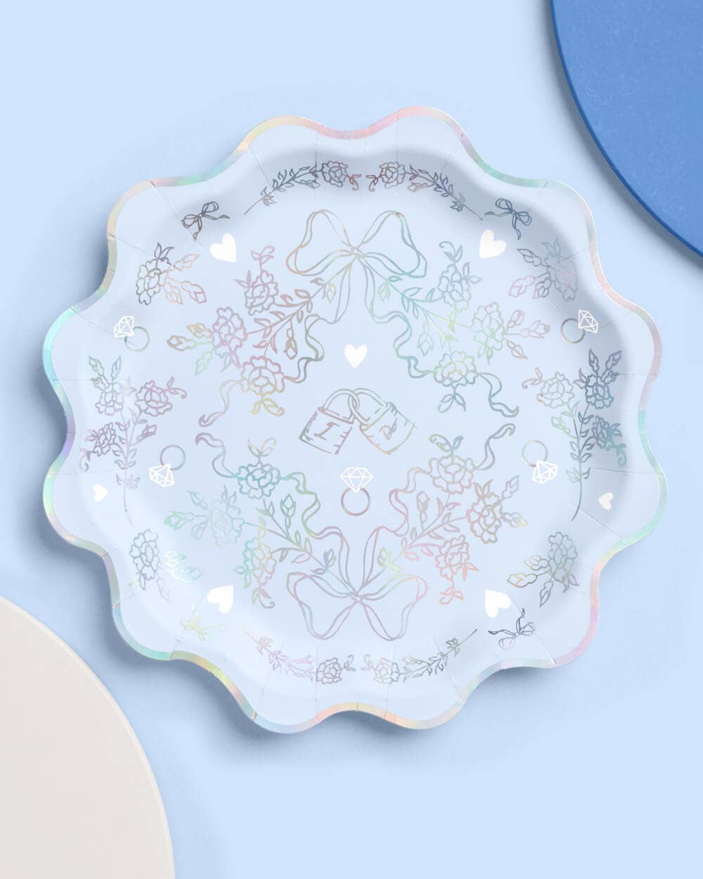 Blue paper party plates with white and iridescent detailing