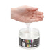 Hand lifting a thick strand of clear Fist It gel out of the open jar