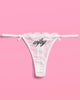 White stretch lace thong with black Wifey embroidery and satin bows