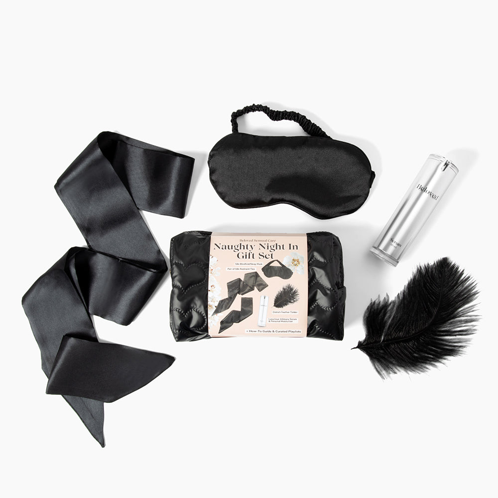 Beloved Naughty Night In Gift Set with black silk blindfold, silk restraint ties, ostrich feather tickler and intimacy serum