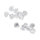 Silver silk rose petals scattered on white