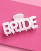 White marble acrylic claw clip shaped from the word BRIDE