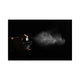 Hand spraying the Black Diamond bottle against a black background, fine mist visible