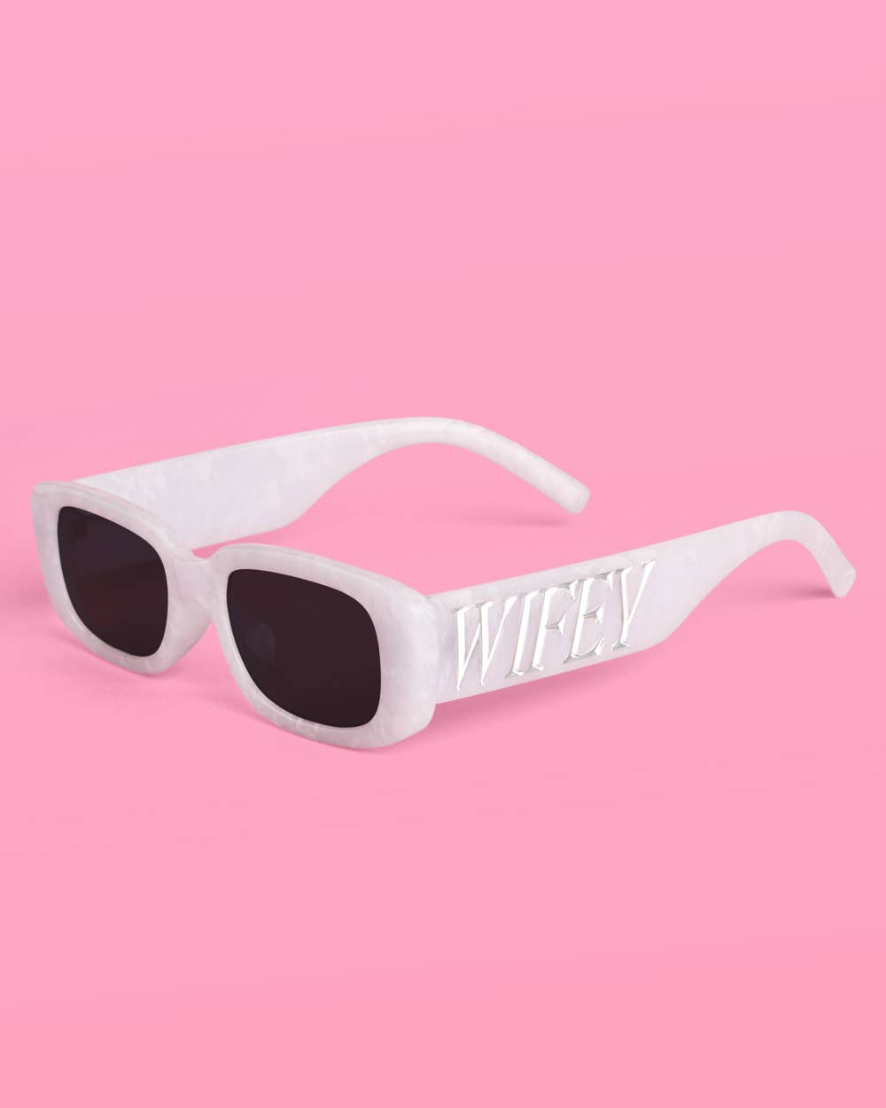 White marble sunglasses with embossed silver WIFEY logo on the temples