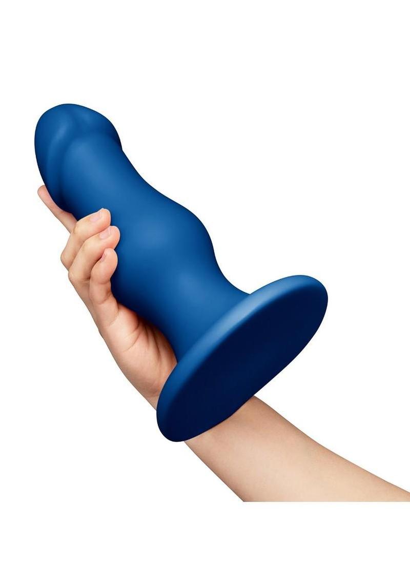 b-Vibe Gape Bulbous Dildo in Blue, held in hand for scale