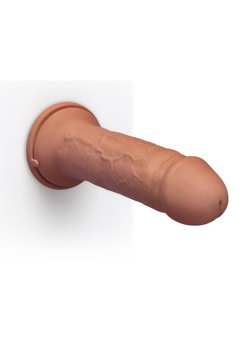 b-Vibe Girth Max-Girth Dildo in Caramel, mounted by suction cup to a wall