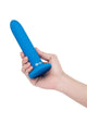 Blue silicone anal dilator, held in hand