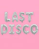 Silver foil letter balloons spelling LAST DISCO on a banner string