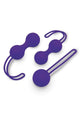 Purple silicone kegel balls, lying angled view