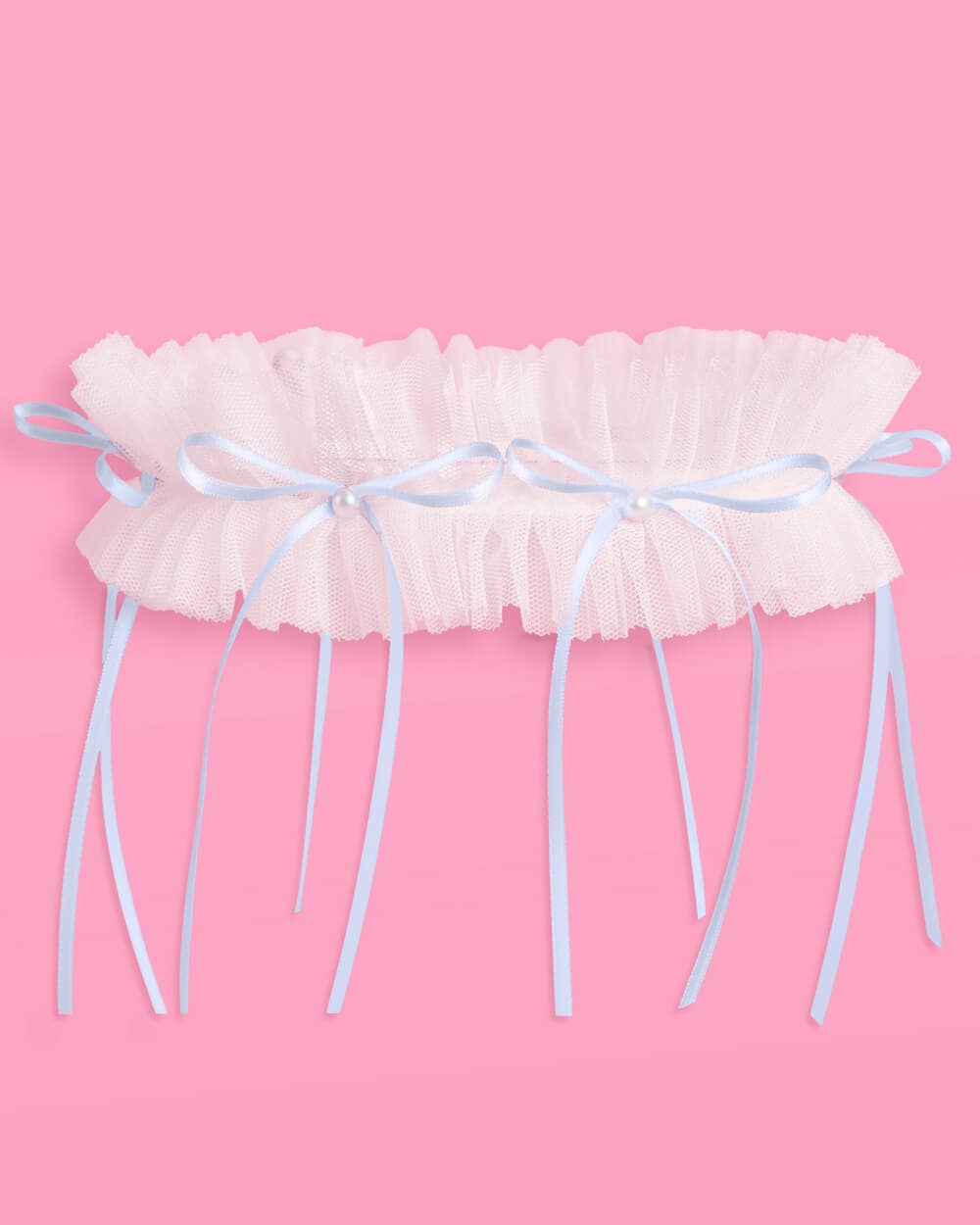 White ruffled tulle bridal garter with blue satin bows and pearl centres