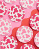 Pink cow print paper party plates in two shades