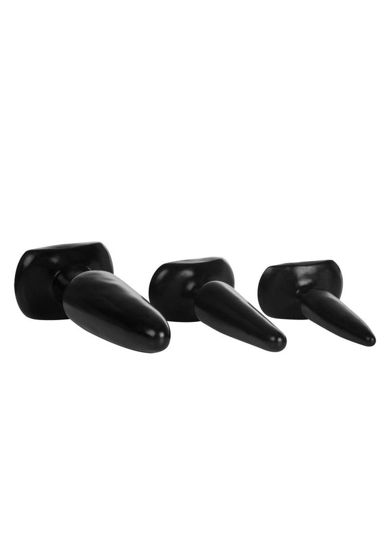 Black rubber butt plugs, lying side view
