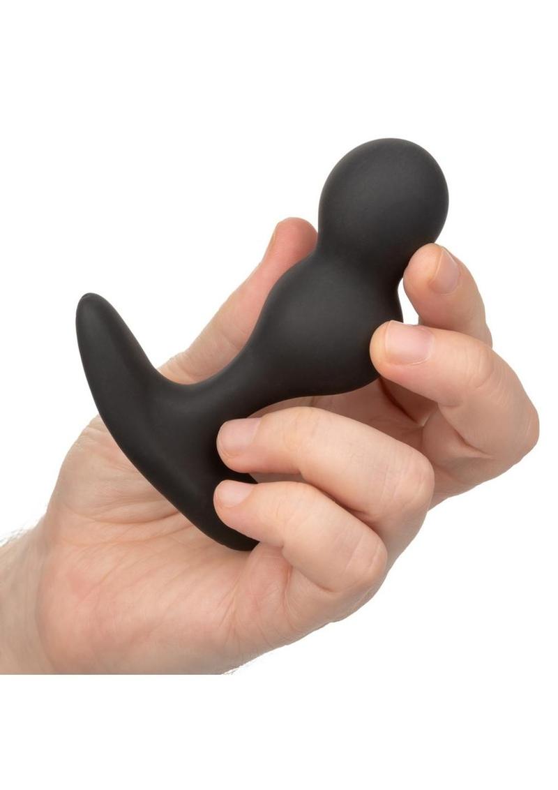 Black dual-bulb probe, held in hand
