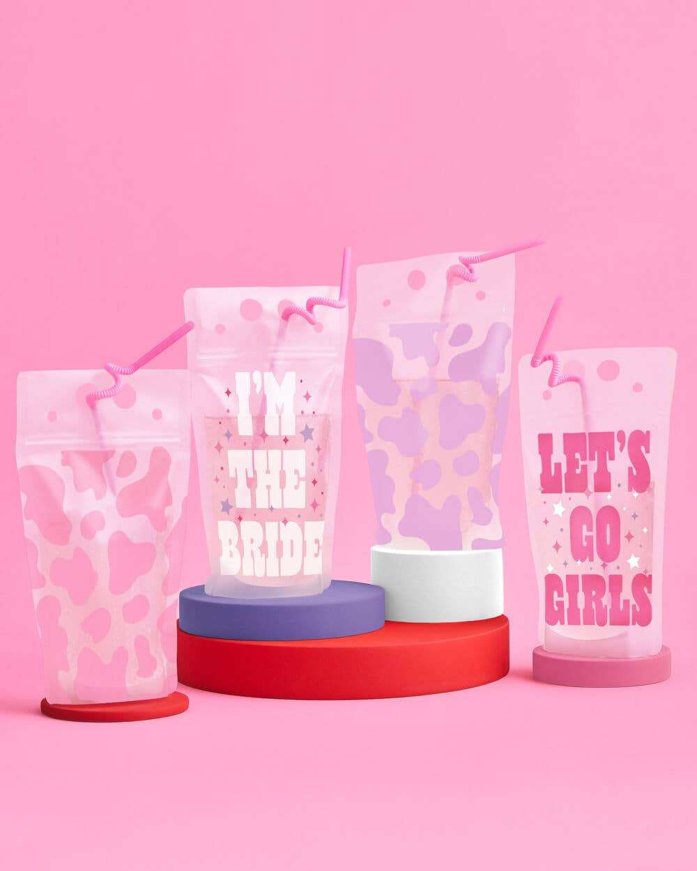 Western cow print and Lets Go Girls reusable drink pouches with pink straws