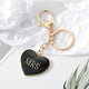 Black enamel heart keychain with gold MRS lettering