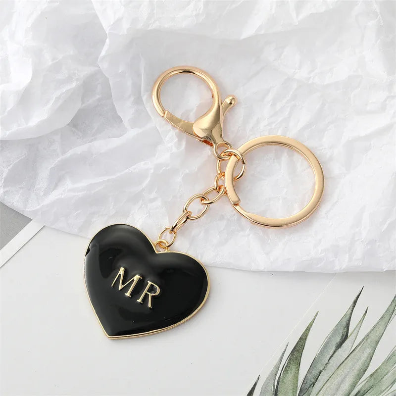 Black enamel heart keychain with gold MR lettering