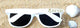 White party sunglasses with BRIDE lettering on the lenses