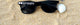 Black party sunglasses with GROOM lettering on the lenses