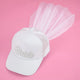 White baseball cap with rhinestone BRIDE lettering and a tulle veil