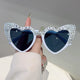 White heart-shaped sunglasses with rhinestone Bride To Be lettering and grey lenses