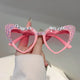 Pink heart-shaped sunglasses with rhinestone Bride To Be lettering and gradient pink lenses