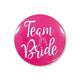 Rose red 58mm tinplate pin badge reading TEAM BRIDE