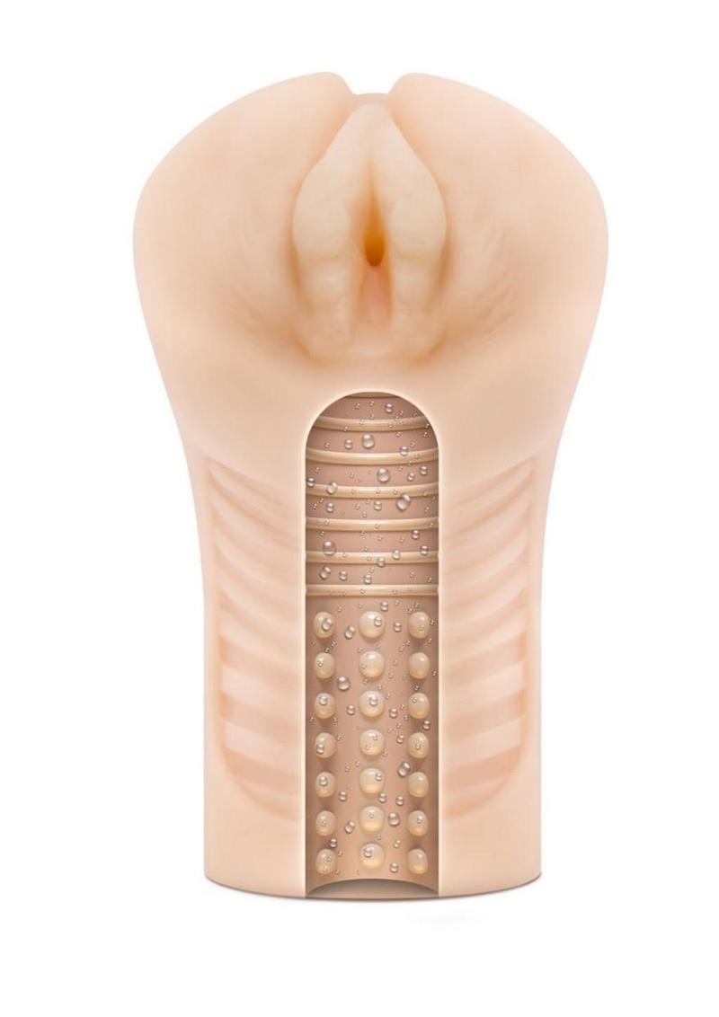 Flesh toned male stroker sleeve with a realistic vulva style opening and a cutaway view showing the textured internal canal, displayed against a white background.