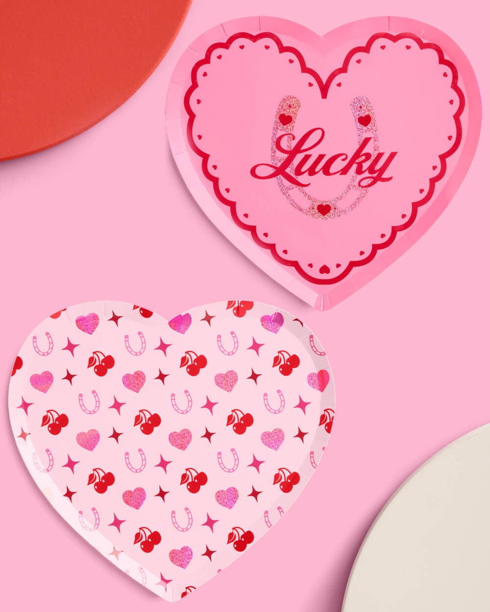 Pink heart shaped paper party plates with holographic foil detailing