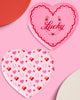 Pink heart shaped paper party plates with holographic foil detailing