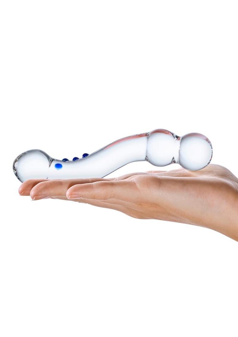 Glas Curved G-Spot Glass Textured Dildo in Clear with blue ridges, resting on a hand for scale
