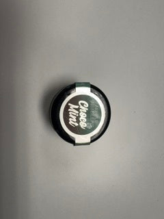 Jelique Nipple Nibblers Cooling Tingle Balm Choco Mint 3g jar, top view of the lid