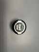 Jelique Nipple Nibblers Cooling Tingle Balm Choco Mint 3g jar, top view of the lid