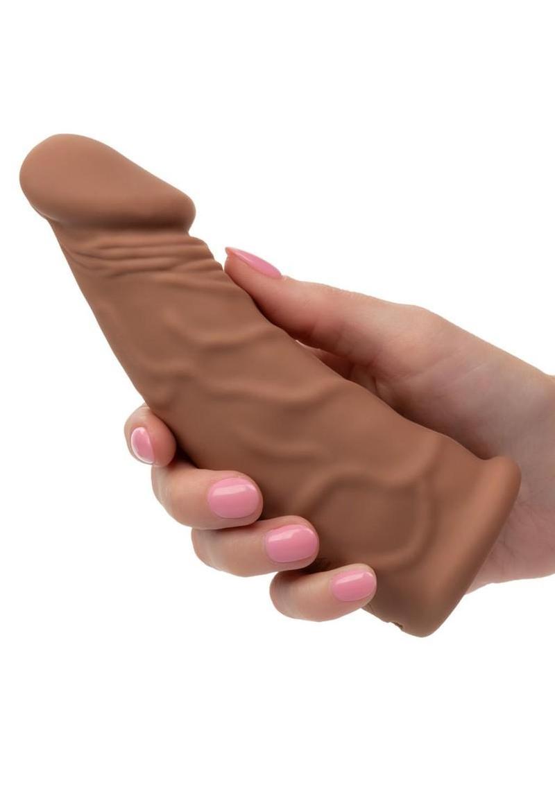 Caramel Performance Maxx Vibrating Extension held in hand