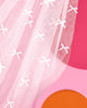 Detail of double layered white tulle with scattered bows