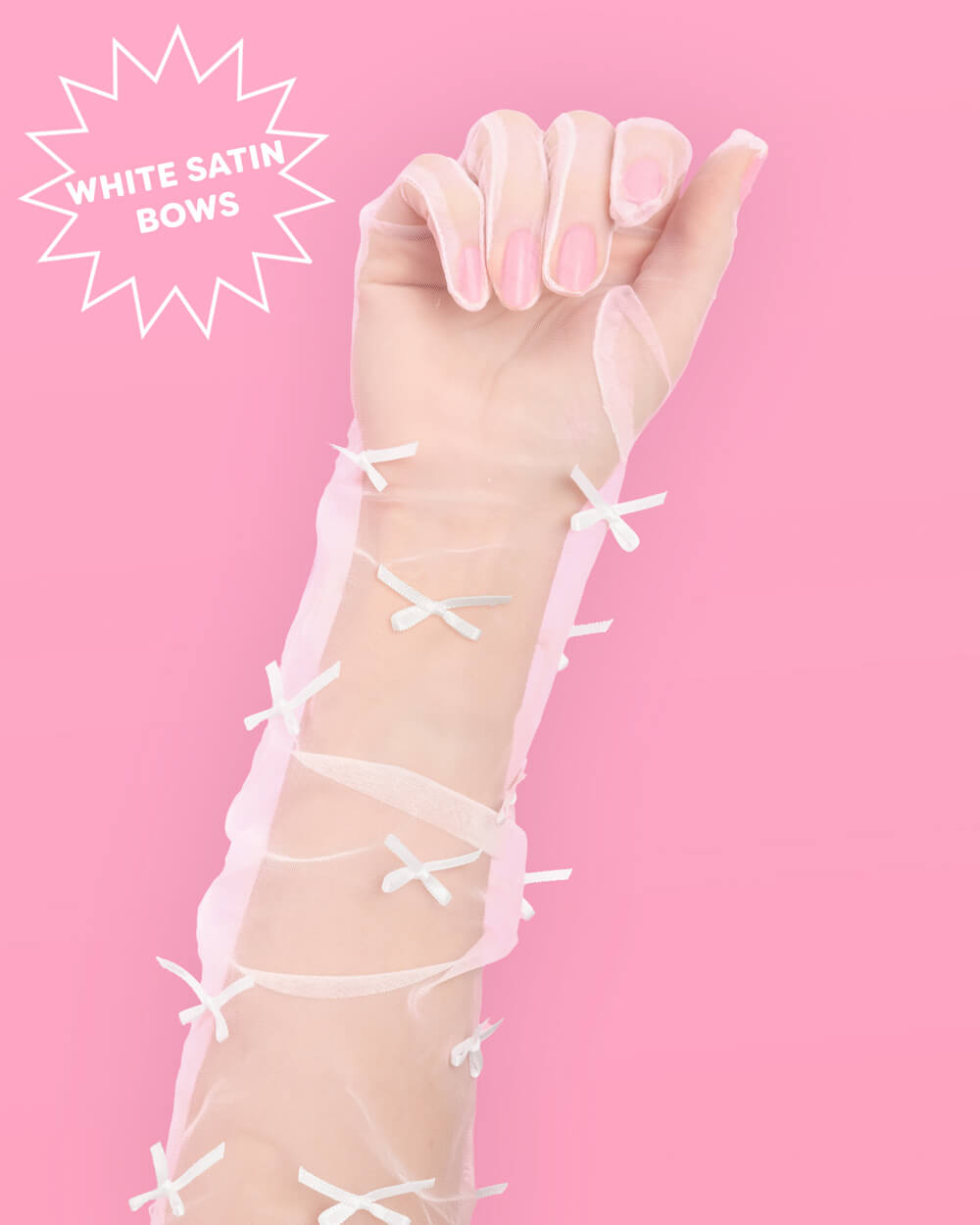 Sheer white organza glove on the hand with satin bows