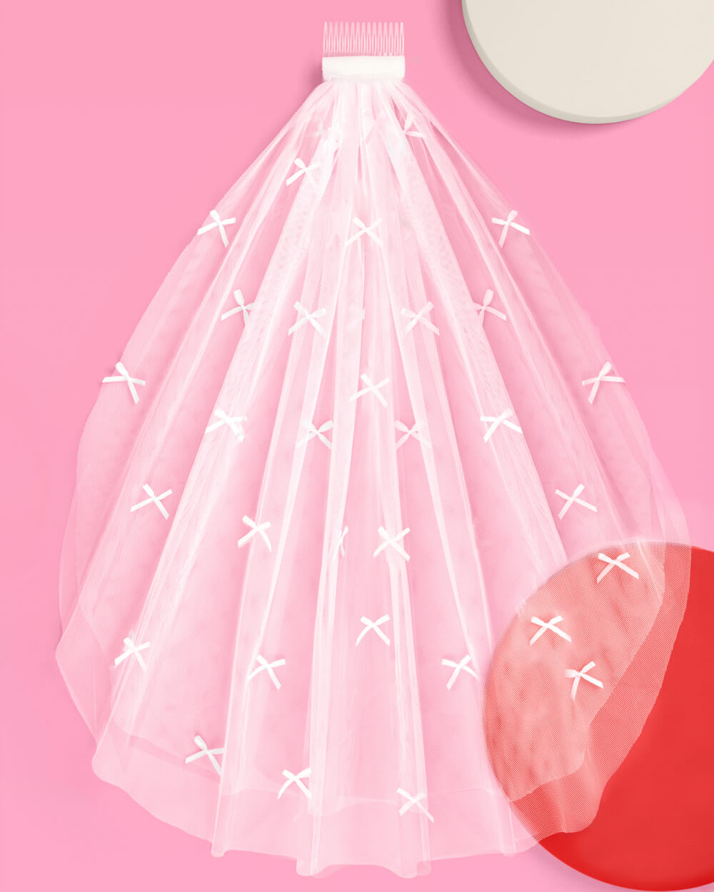 White mini bow veil spread flat showing full length