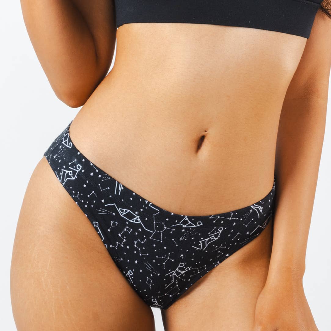 Navy bikini underwear with a glow-in-the-dark constellation print, front view