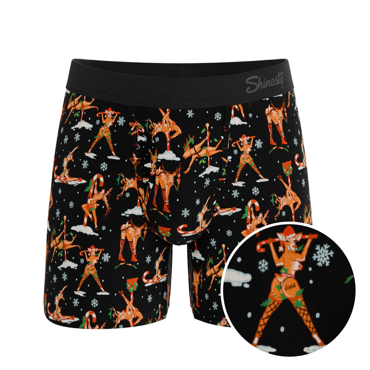 Black boxer brief with an orange dancing reindeer print, front view with print detail inset
